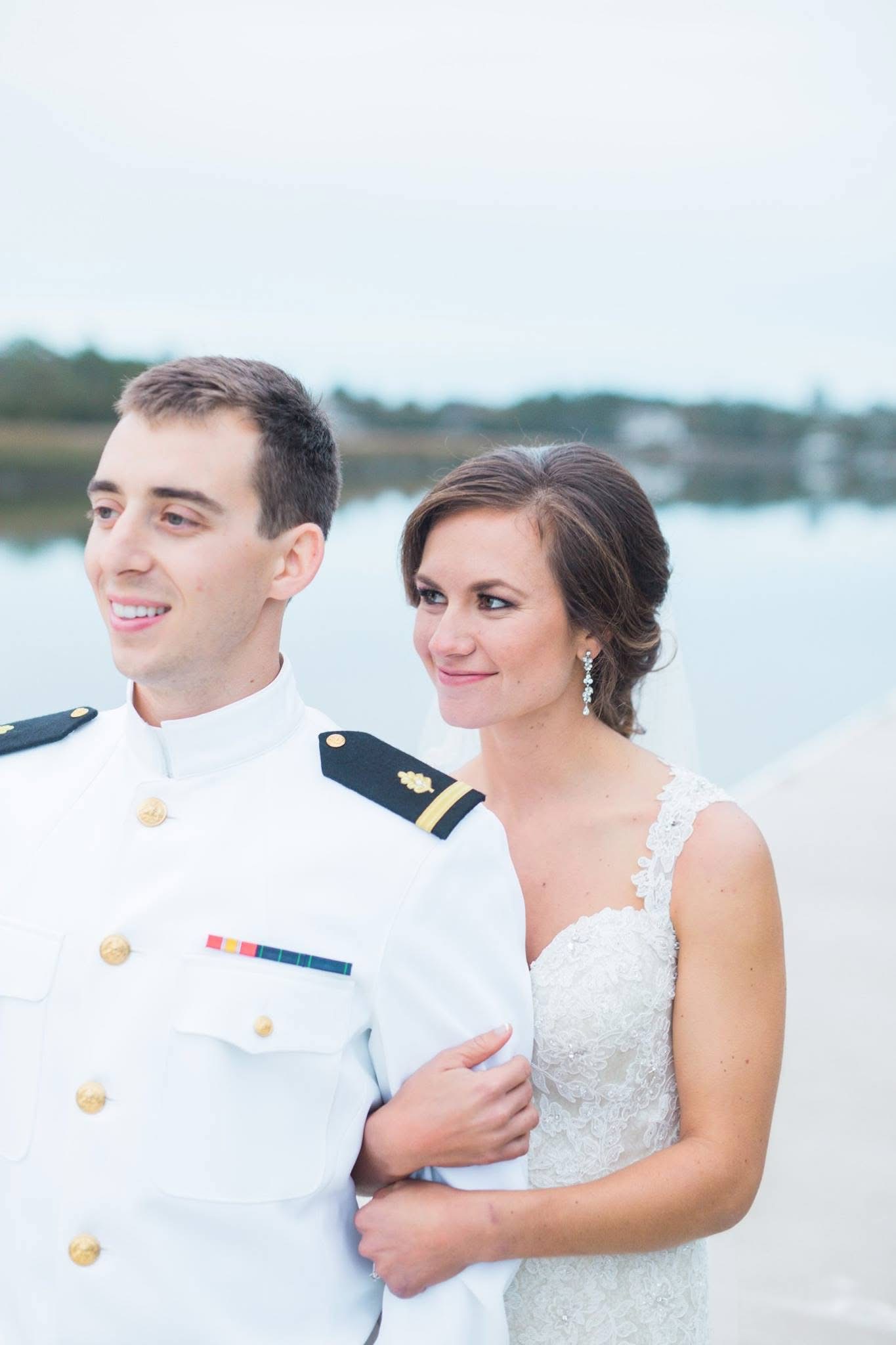 Fine art wedding details including custom place settings and lush floral arrangements